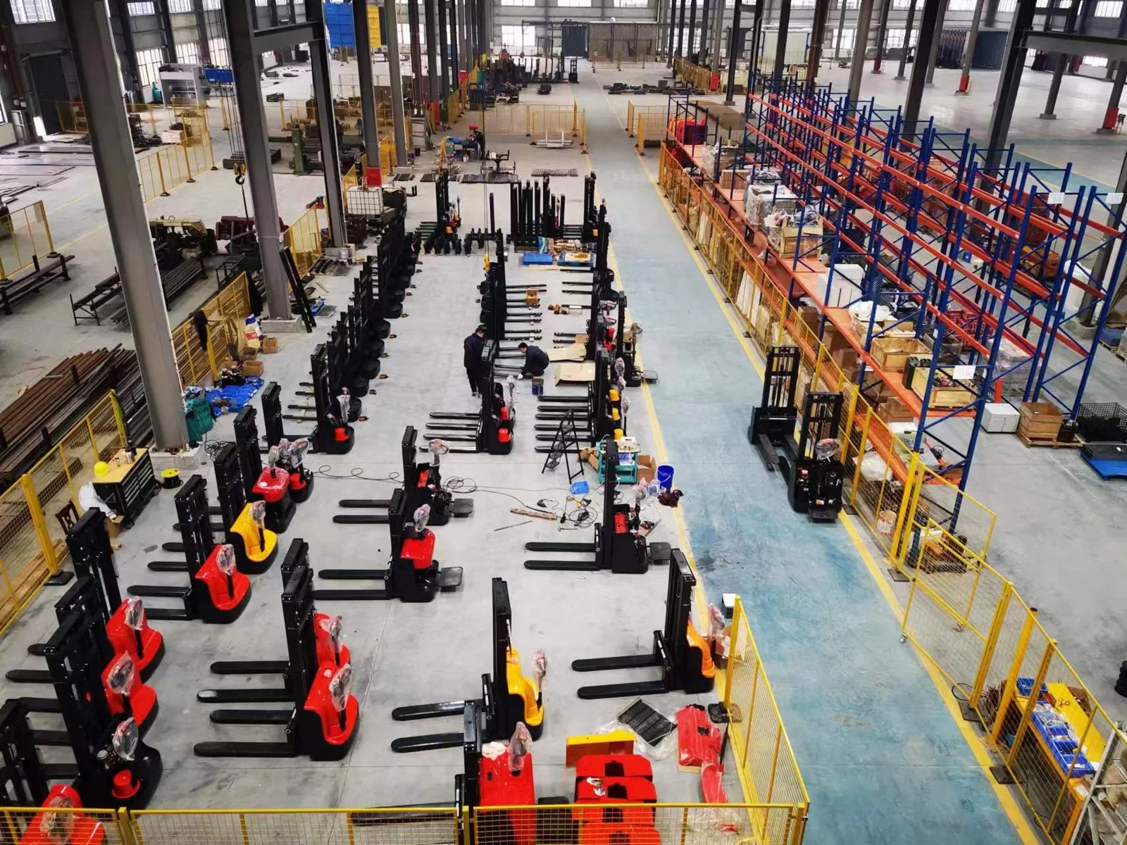 Electric stacker assembly area and component storage racks